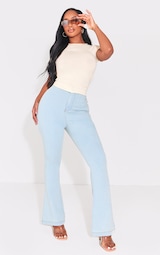 PRETTYLITTLETHING Shape Light Blue Wash Split Hem Detail Flared Jeans